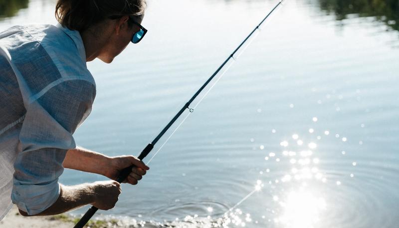 Angler wearing polarised fishing sunglasses