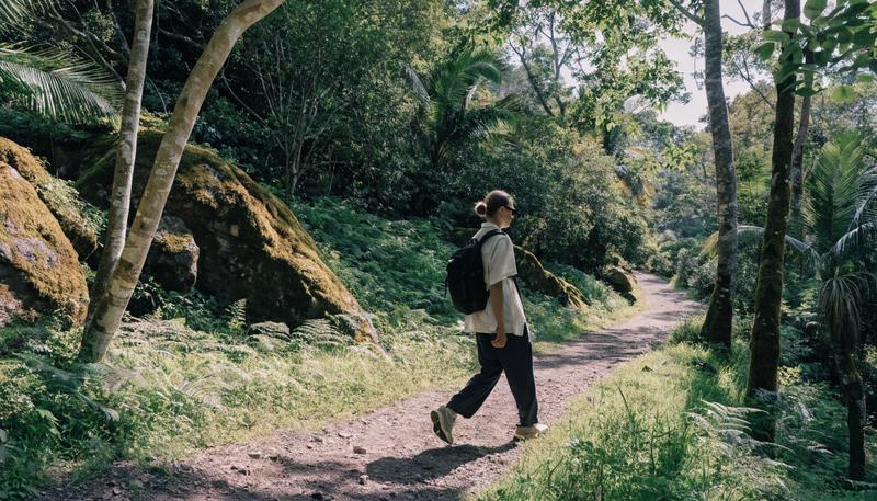 Hiker wearing sport sunglasses on a trail
