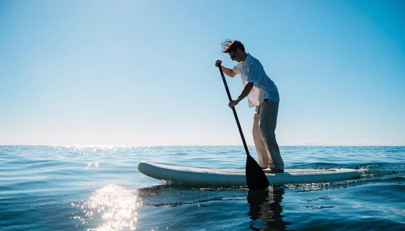 Water sports athlete wearing floating sunglasses