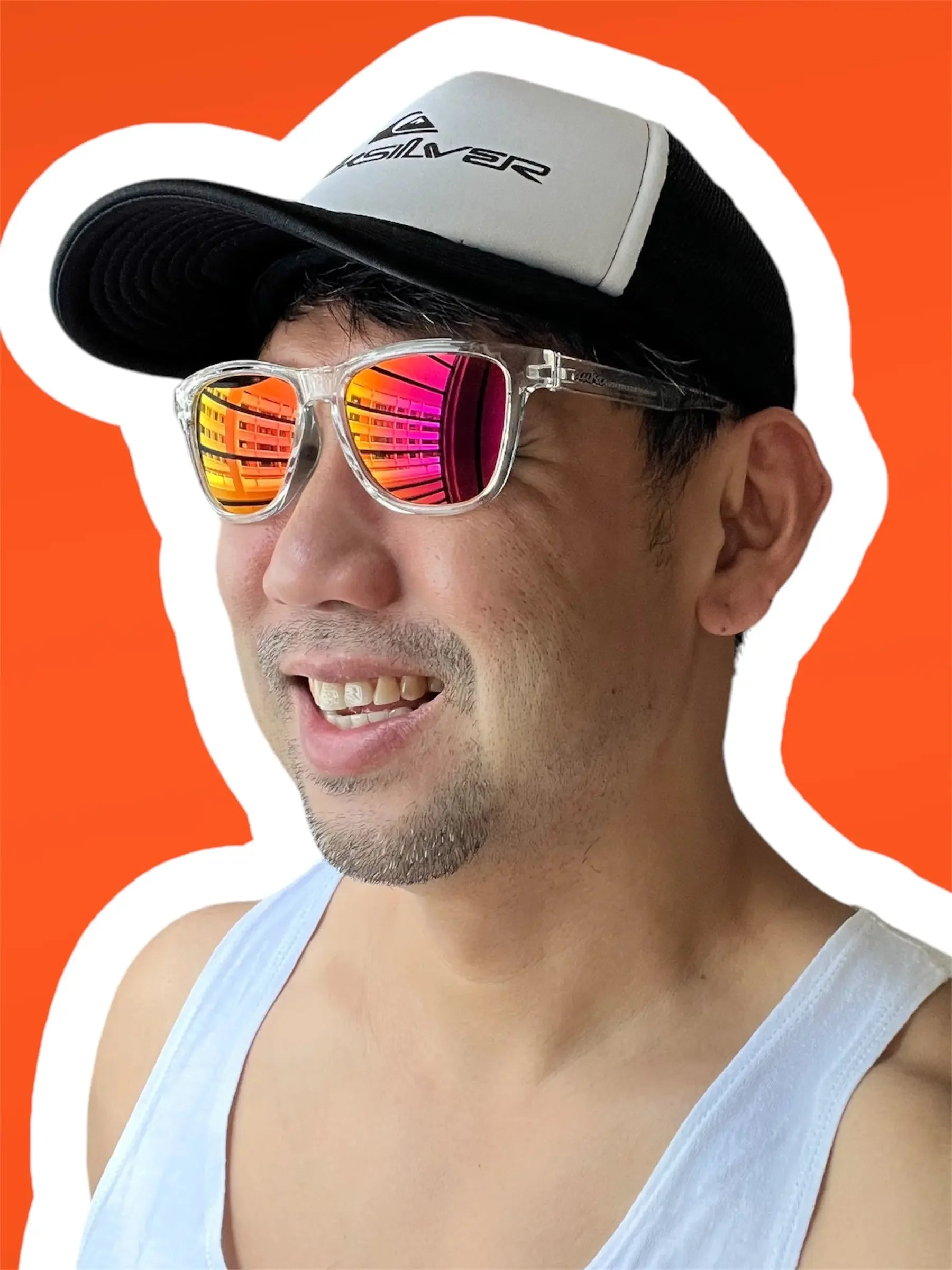 Man in cap and tank top wearing mirrored polarized sunglasses, bright orange background